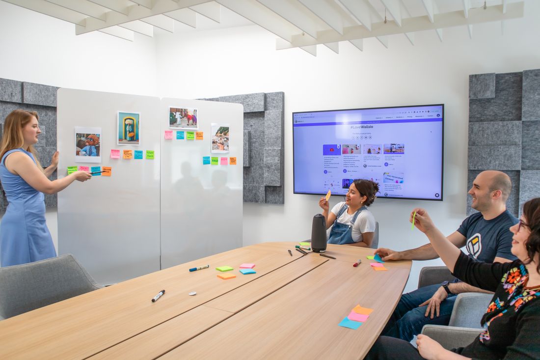 A team planning campaigns with sticky notes on a whiteboard