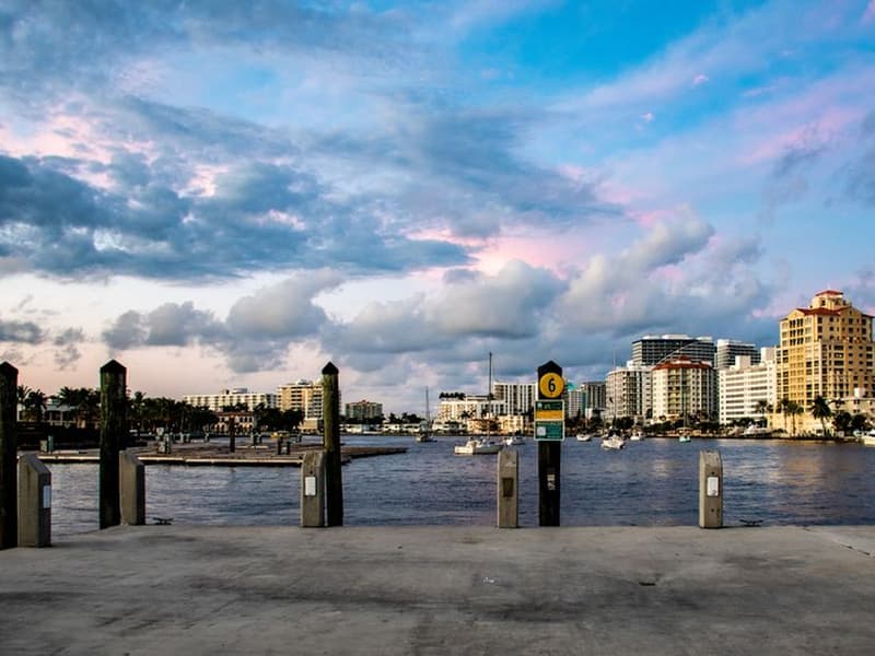 Waterfront skyline at sunset seen from a dock