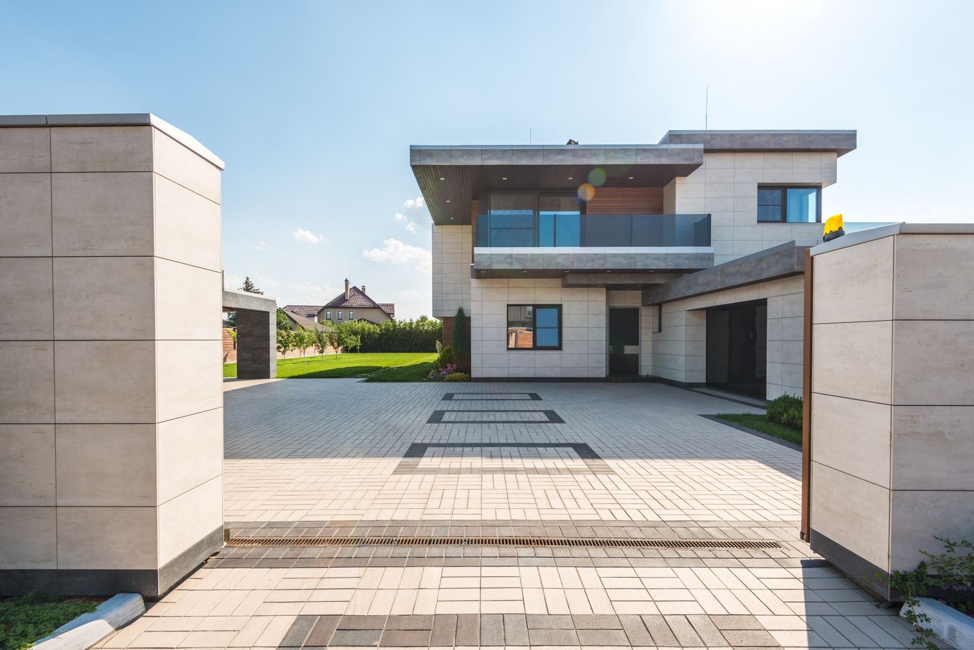 Two-storey contemporary home with a paved courtyard