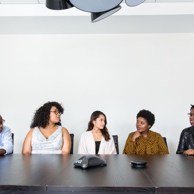 Colleagues in a meeting around a conference table
